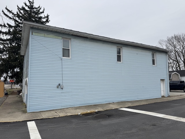 view of property exterior featuring a garage