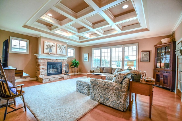 1205 Daylily Way, Troy, OH 45373 - living room featuring light wood finished floors, a glass covered fireplace, ornamental molding, coffered ceiling, and beam ceiling