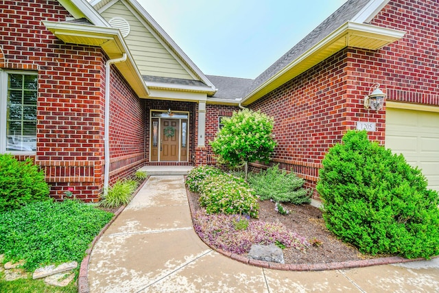 1205 Daylily Way, Troy, OH 45373 - property entrance featuring brick siding, a garage, and roof with shingles
