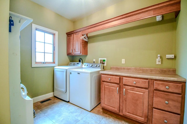 1205 Daylily Way, Troy, OH 45373 - laundry room featuring cabinet space and washing machine and clothes dryer