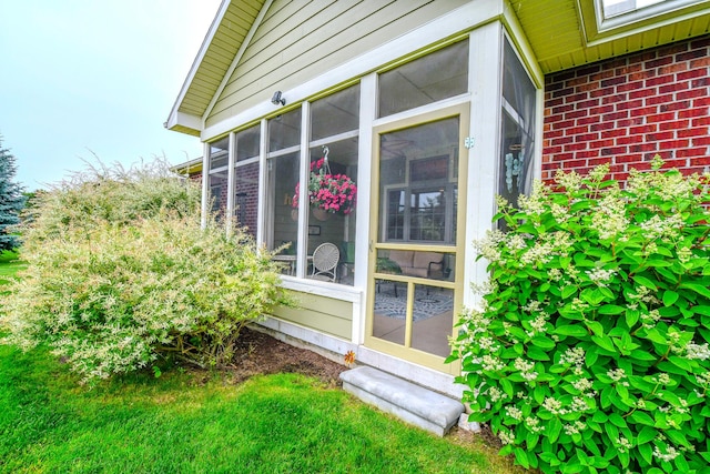 1205 Daylily Way, Troy, OH 45373 - view of side of property featuring brick siding and a sunroom