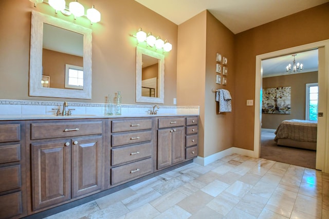 1205 Daylily Way, Troy, OH 45373 - bathroom with ensuite bathroom, double vanity, and a chandelier