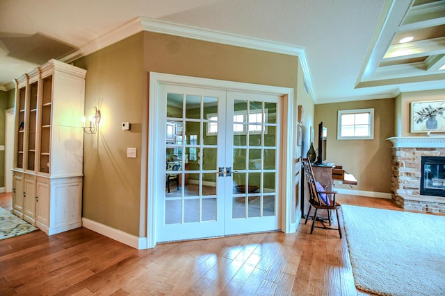 1205 Daylily Way, Troy, OH 45373 - doorway to outside featuring french doors, crown molding, wood finished floors, and a stone fireplace