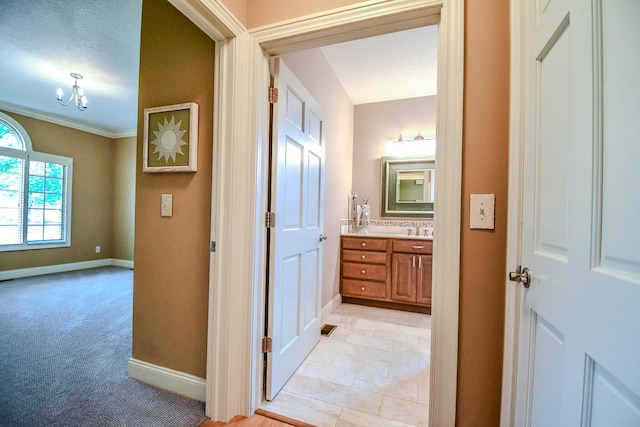 1205 Daylily Way, Troy, OH 45373 - bathroom featuring vanity, ornamental molding, and a chandelier