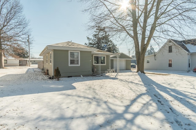 bungalow-style home featuring a detached garage