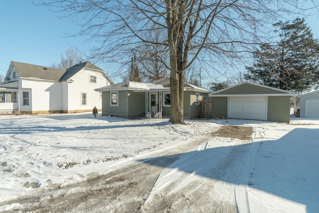 view of front facade with a garage and an outdoor structure