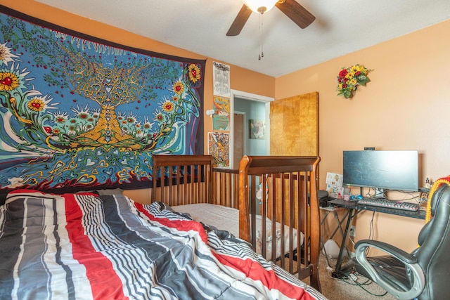 bedroom with a ceiling fan and carpet