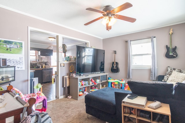 living room with ceiling fan, ornamental molding, and carpet