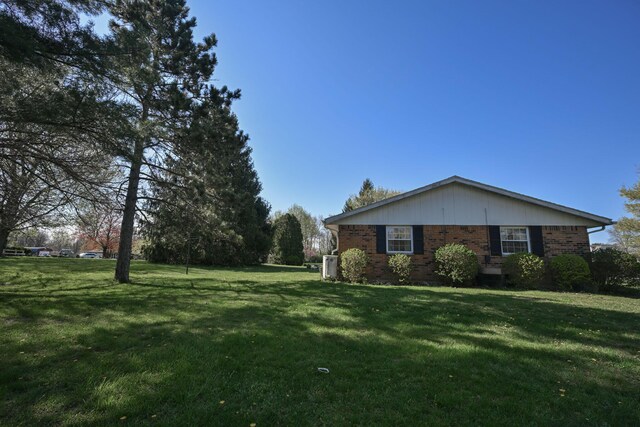 5283 Willow Dale Rd, Urbana, OH 43078 - exterior space with brick siding and a yard
