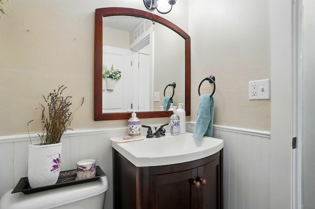 2206 State Route 56, London, OH 43140 - half bath with wainscoting, vanity, and toilet