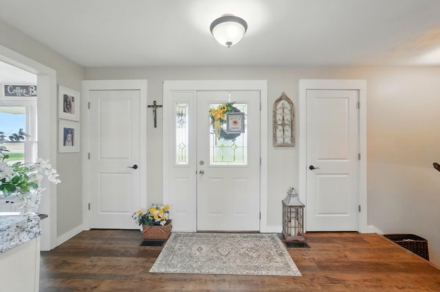 2206 State Route 56, London, OH 43140 - foyer entrance featuring dark wood-style flooring and baseboards