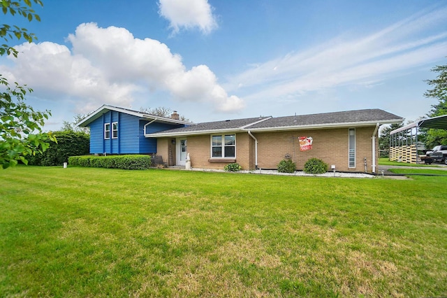2206 State Route 56, London, OH 43140 - split level home featuring brick siding, a front lawn, a chimney, and a carport