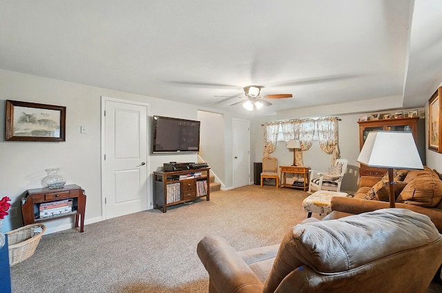 2206 State Route 56, London, OH 43140 - living room featuring ceiling fan, light carpet, and baseboards