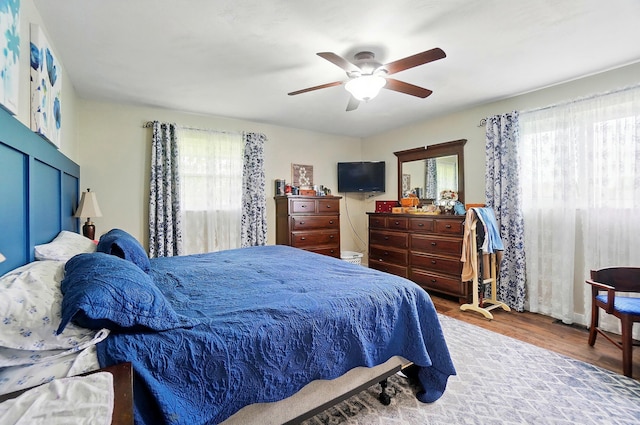 2206 State Route 56, London, OH 43140 - bedroom with multiple windows, wood finished floors, and ceiling fan