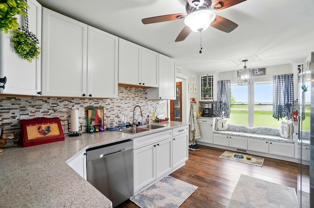 2206 State Route 56, London, OH 43140 - kitchen featuring stainless steel dishwasher, a sink, and white cabinets