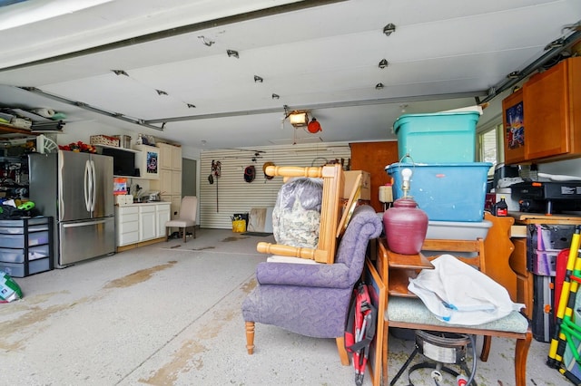 2206 State Route 56, London, OH 43140 - garage featuring freestanding refrigerator and a garage door opener