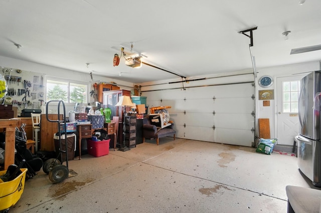 2206 State Route 56, London, OH 43140 - garage with freestanding refrigerator and a garage door opener