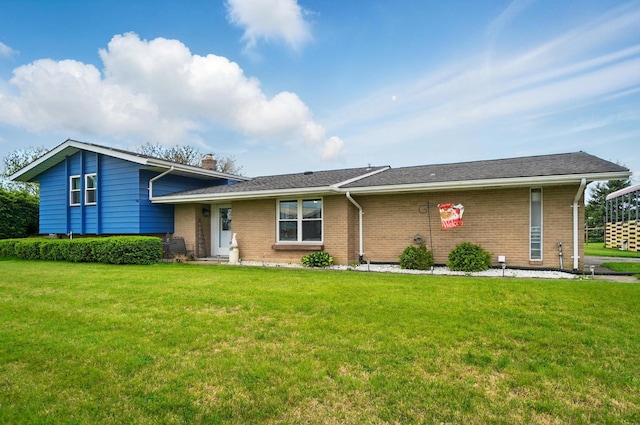 2206 State Route 56, London, OH 43140 - tri-level home with brick siding, a chimney, and a front lawn