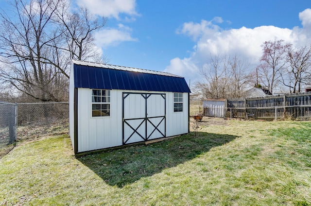 view of shed with a fenced backyard