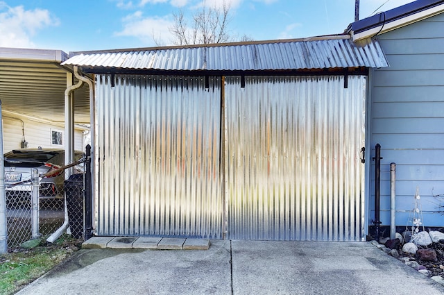 view of gate with fence