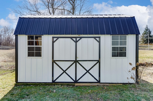 view of shed with fence