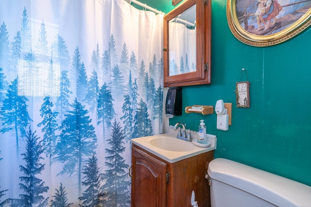 full bathroom with vanity and toilet