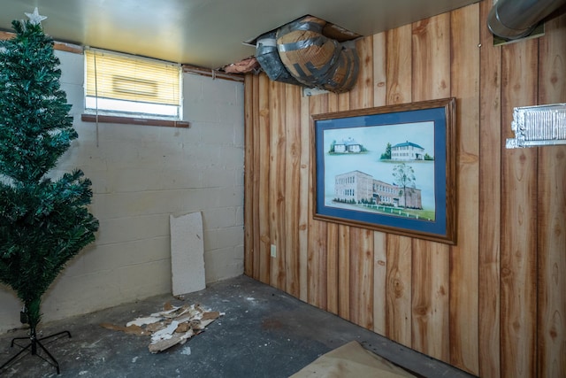 basement featuring concrete block wall