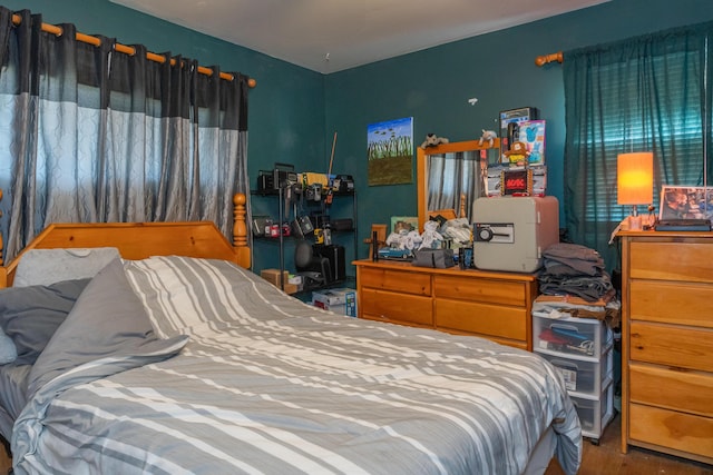 bedroom with wood finished floors