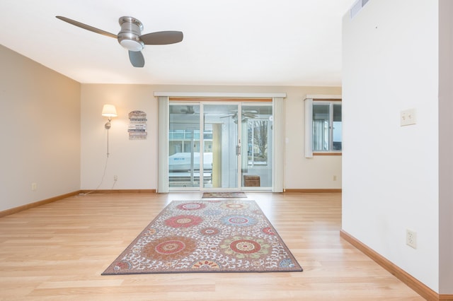 interior space with ceiling fan and light wood-type flooring