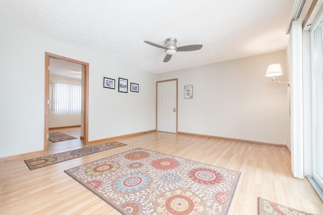 unfurnished room featuring ceiling fan and light hardwood / wood-style floors