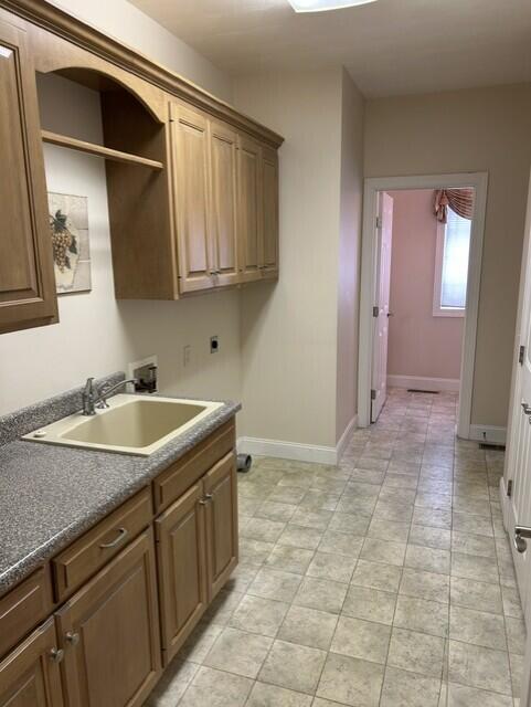207 Meadowbrook Ln, Saint Marys, OH 45885 - laundry room with hookup for an electric dryer, washer hookup, cabinet space, baseboards, and light tile patterned flooring