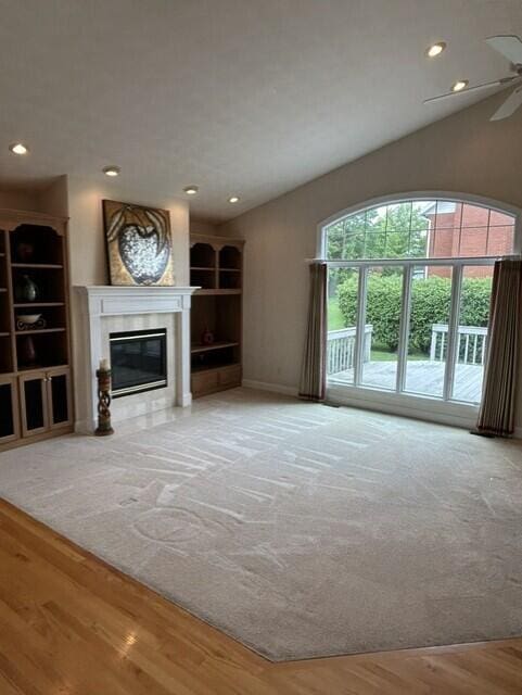 207 Meadowbrook Ln, Saint Marys, OH 45885 - unfurnished living room featuring a ceiling fan, a glass covered fireplace, wood finished floors, recessed lighting, and baseboards