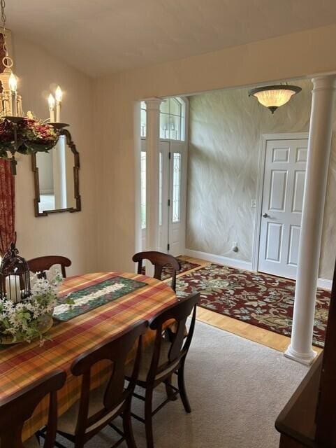 207 Meadowbrook Ln, Saint Marys, OH 45885 - dining area with decorative columns, wood finished floors, and baseboards