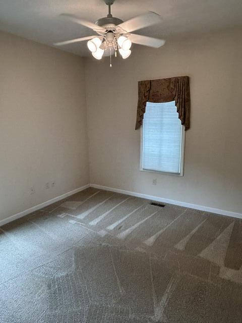 207 Meadowbrook Ln, Saint Marys, OH 45885 - unfurnished room with a ceiling fan, carpet, and baseboards