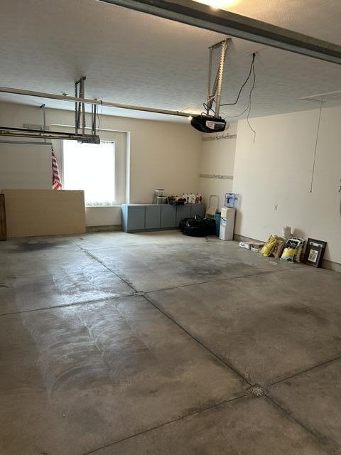 207 Meadowbrook Ln, Saint Marys, OH 45885 - garage featuring a garage door opener