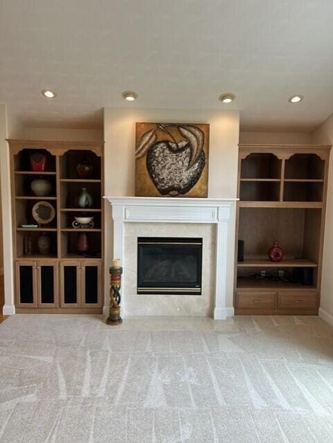 207 Meadowbrook Ln, Saint Marys, OH 45885 - carpeted living room with a glass covered fireplace, recessed lighting, and baseboards