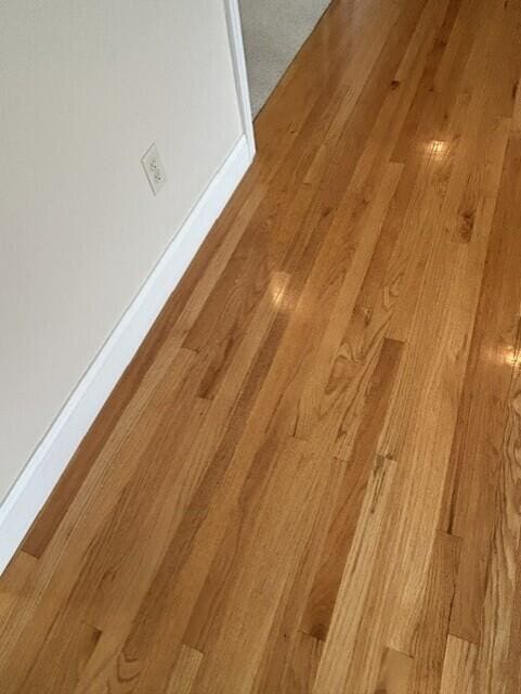207 Meadowbrook Ln, Saint Marys, OH 45885 - detailed view of wood finished floors and baseboards