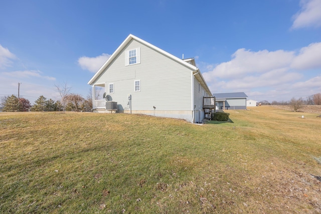 view of home's exterior with a lawn