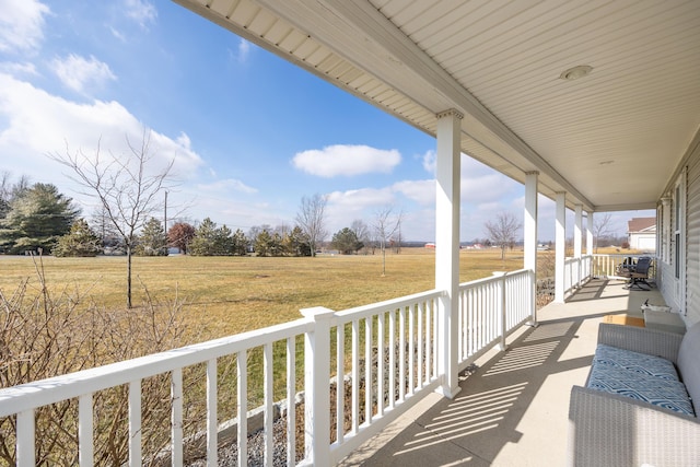 balcony with a porch and a rural view