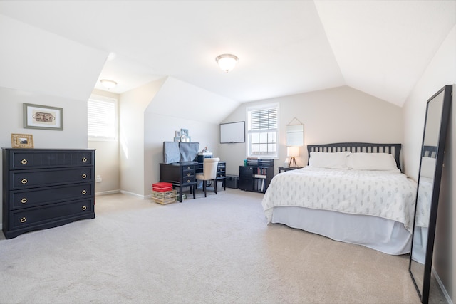 carpeted bedroom featuring lofted ceiling