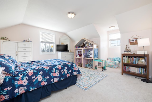 carpeted bedroom with lofted ceiling