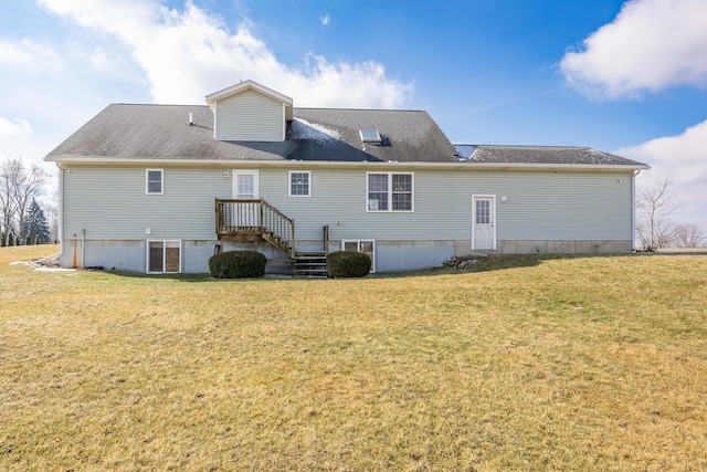 rear view of house with a lawn