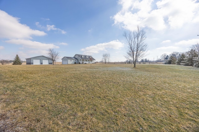 view of yard with a rural view