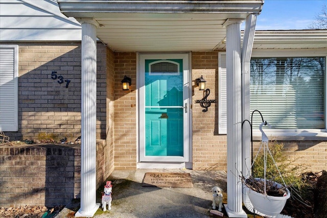 entrance to property with brick siding