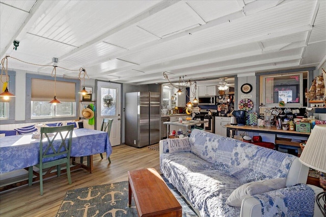 living room with light wood finished floors and ceiling fan