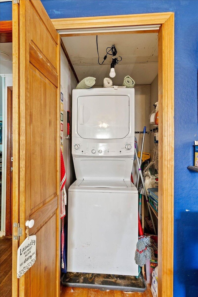 laundry area with stacked washer / dryer