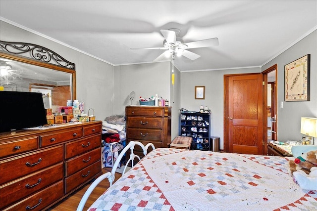 bedroom featuring crown molding, a ceiling fan, and dark wood-style flooring