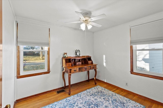 sitting room featuring visible vents, a healthy amount of sunlight, baseboards, and light wood-style floors