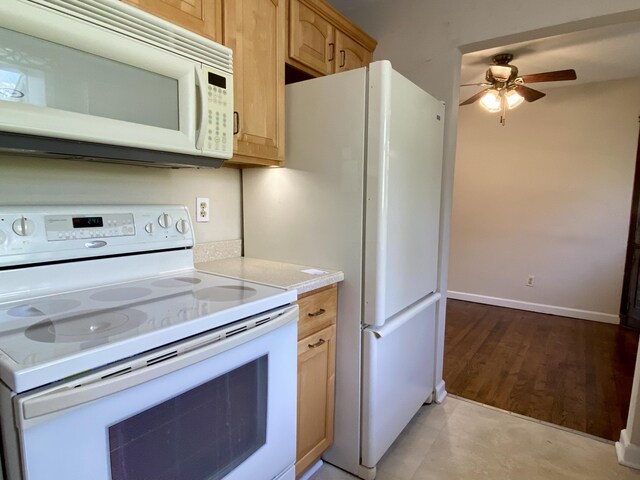 306 S 7th St, Miamisburg, OH 45342 - kitchen with a ceiling fan, light brown cabinetry, light countertops, baseboards, and white appliances