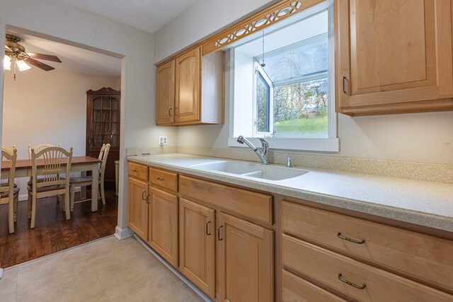 306 S 7th St, Miamisburg, OH 45342 - kitchen featuring a sink, ceiling fan, and light countertops